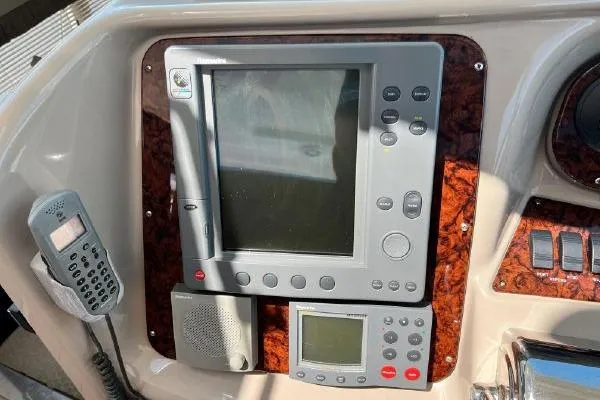 Slide: The Image of Control panel of a 2004 Sea Ray 390 Motor Yacht with navigation equipment. - 11