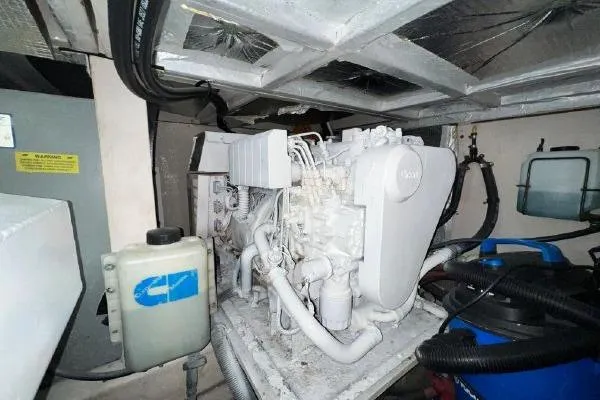 Slide: The Image of Engine room of 2004 Sea Ray 390 Motor Yacht, showcasing mechanical components and equipment. - 32