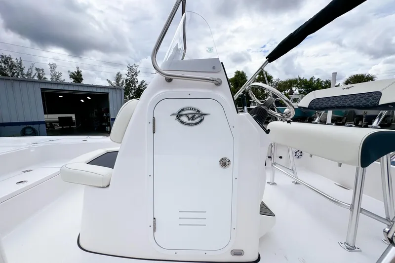 Slide: The Image of 2026 Tidewater 2110 Bay Max boat console with steering wheel and seating. - 10