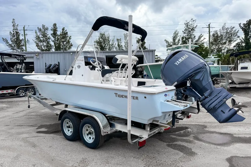 Slide: The Image of 2026 Tidewater 2110 Bay Max boat with Yamaha engine on trailer. - 2
