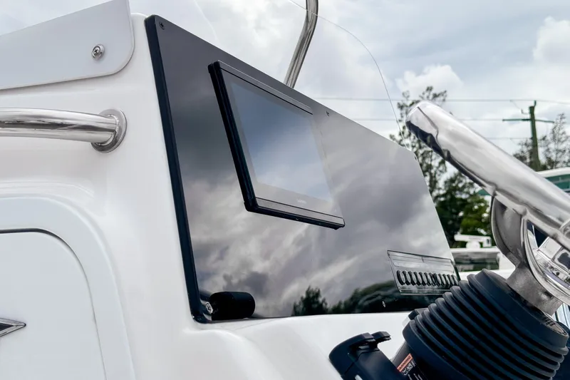 Slide: The Image of 2026 Tidewater 2110 Bay Max boat dashboard with steering wheel and display screen. - 8