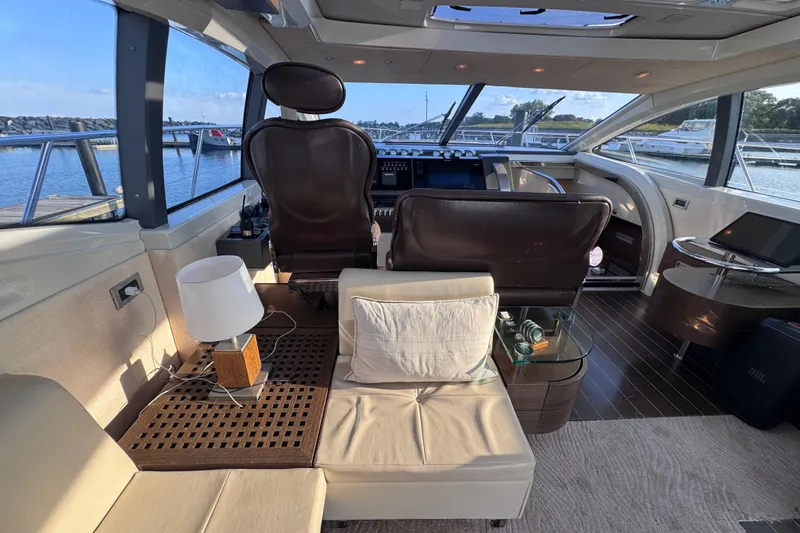 Slide: The Image of Luxurious interior of a 2006 Azimut 68S yacht with leather seating and panoramic windows. - 19