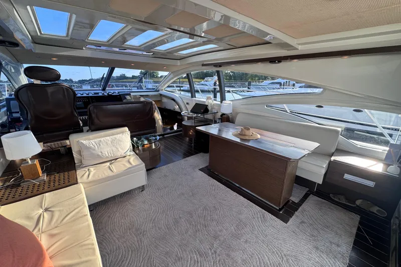 Slide: The Image of Luxurious interior of a 2006 Azimut 68S yacht with elegant seating and panoramic windows. - 20