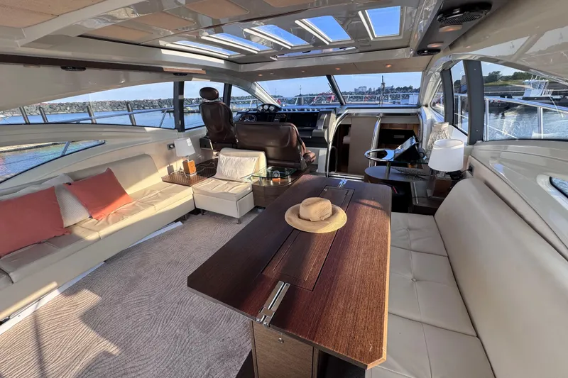 Slide: The Image of Luxurious interior of 2006 Azimut 68S yacht with elegant seating and panoramic windows. - 21