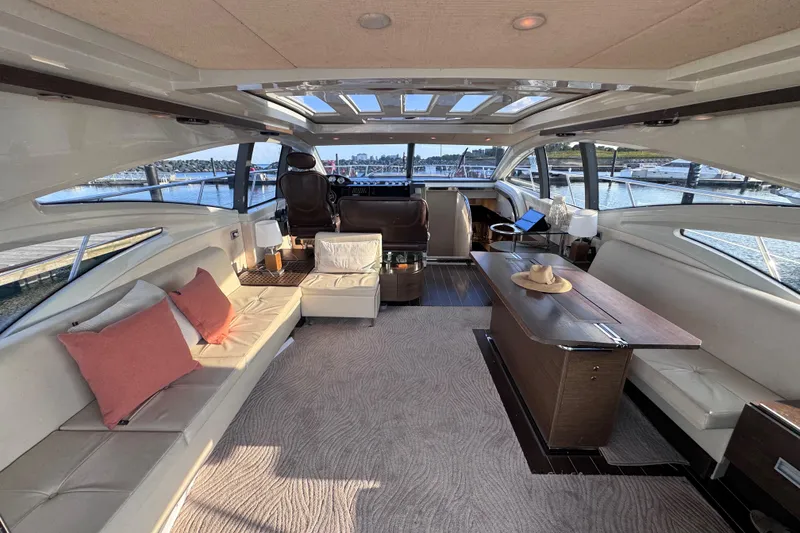 Slide: The Image of Luxurious interior of a 2006 Azimut 68S yacht with elegant seating and panoramic windows. - 23