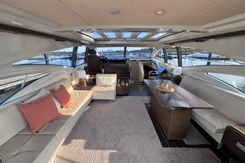 Slide: The Image of Luxurious interior of a 2006 Azimut 68S yacht with elegant seating and panoramic windows. - 24