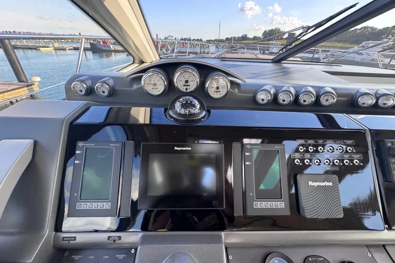 Slide: The Image of Control panel of a 2006 Azimut 68S yacht with Raymarine navigation displays. - 27
