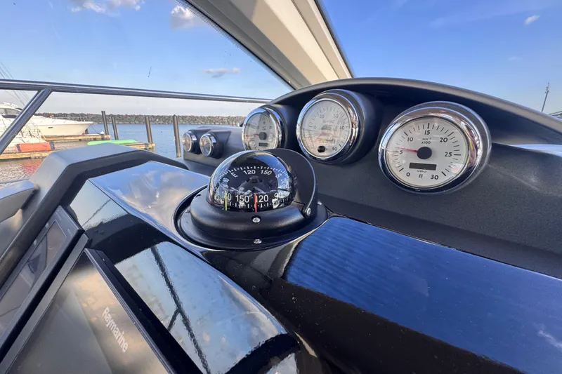 Slide: The Image of Dashboard of a 2006 Azimut 68S yacht with compass and gauges. - 31