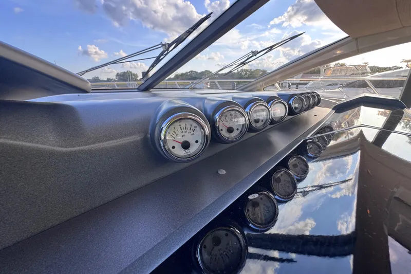 Slide: The Image of Dashboard of 2006 Azimut 68S yacht with gauges and scenic reflections. - 32