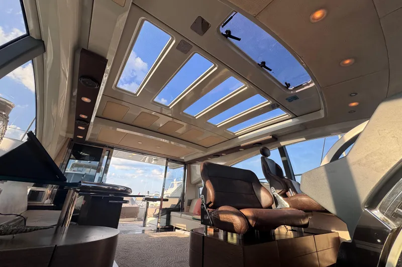 Slide: The Image of Luxurious interior of 2006 Azimut 68S yacht with panoramic sunroof and elegant seating. - 37