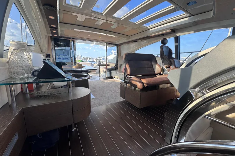 Slide: The Image of Luxurious interior of 2006 Azimut 68S yacht with modern seating and panoramic windows. - 38