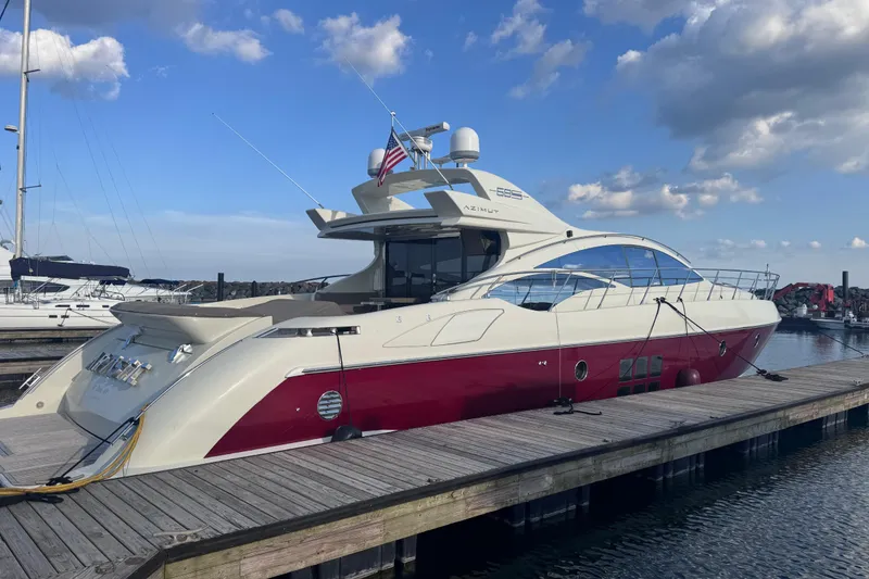 Slide: The Image of Luxury 2006 Azimut 68S yacht docked at marina under blue sky. - 4