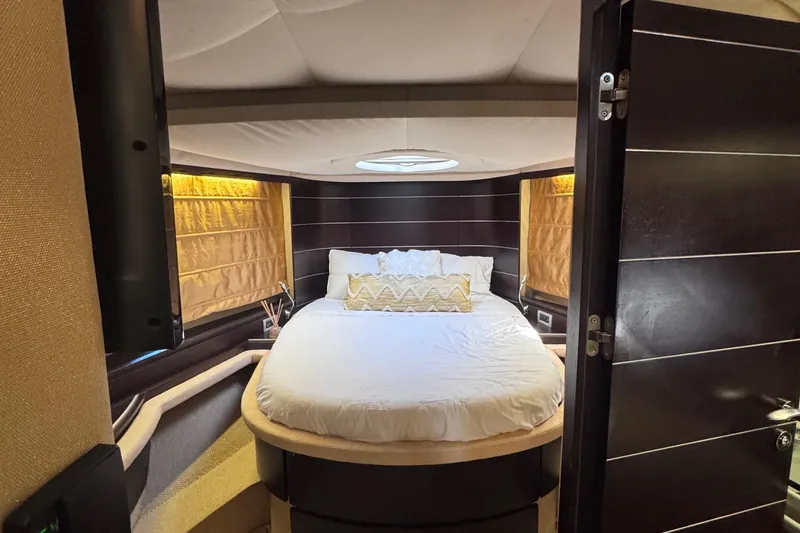 Slide: The Image of Luxurious bedroom interior of 2006 Azimut 68S yacht with modern design and cozy bedding. - 48