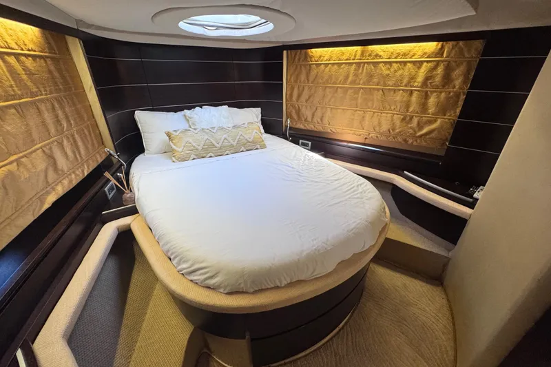 Slide: The Image of Luxurious bedroom interior of 2006 Azimut 68S yacht with elegant bedding and ambient lighting. - 49