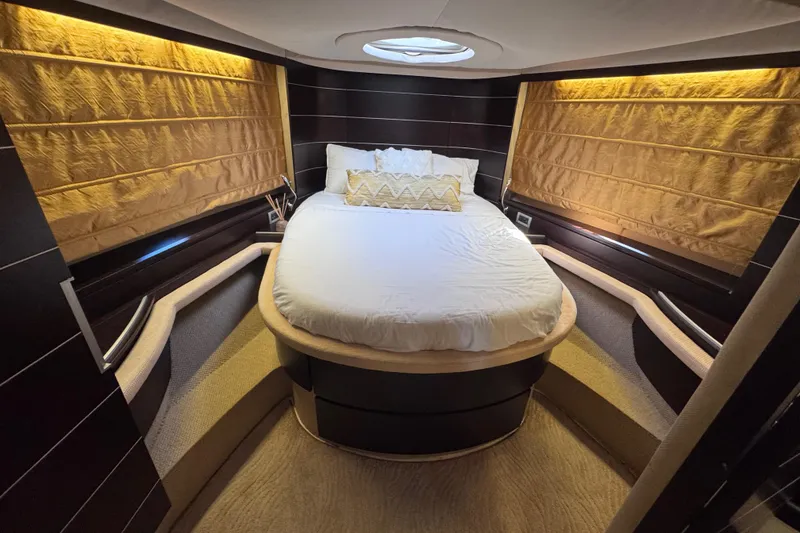 Slide: The Image of Luxurious bedroom interior of 2006 Azimut 68S yacht with elegant lighting and cozy bedding. - 50
