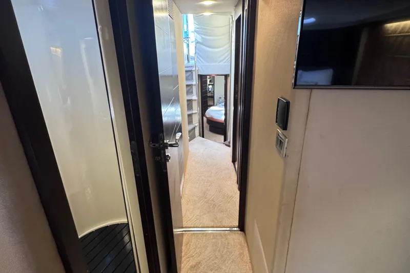 Slide: The Image of Interior hallway of 2006 Azimut 68S yacht, featuring modern design and cozy bedroom. - 59