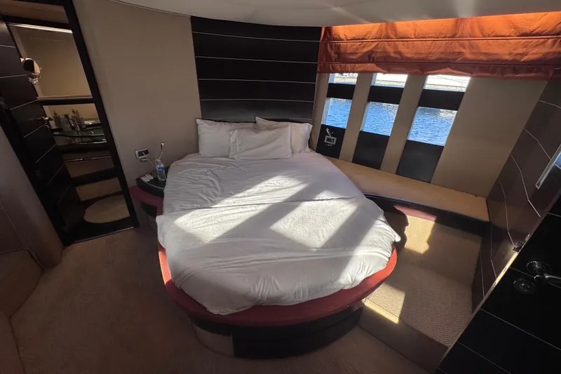 Slide: The Image of Luxurious bedroom interior of 2006 Azimut 68S yacht with round bed and ocean view. - 66