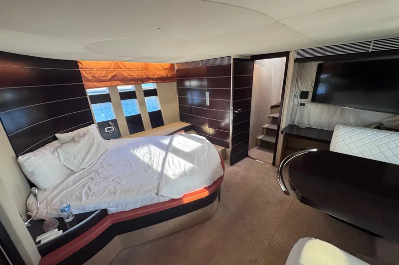 Slide: The Image of Luxurious 2006 Azimut 68S yacht interior with modern bedroom and elegant furnishings. - 67