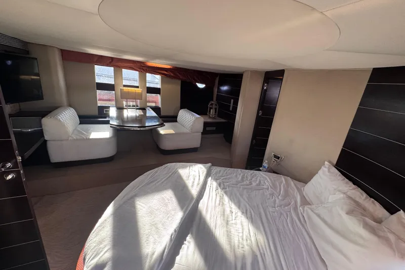 Slide: The Image of Luxurious interior of 2006 Azimut 68S yacht with elegant seating and round bed. - 68