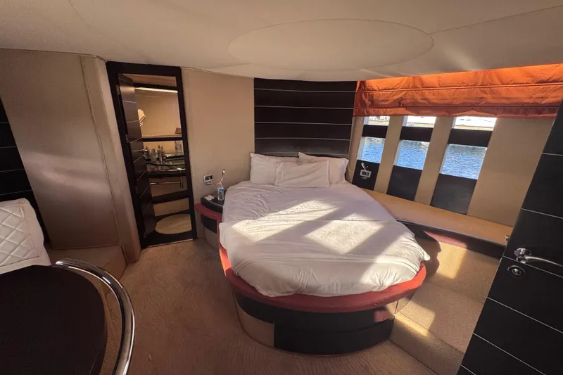 Slide: The Image of Luxurious bedroom interior of 2006 Azimut 68S yacht with modern design and waterfront view. - 74