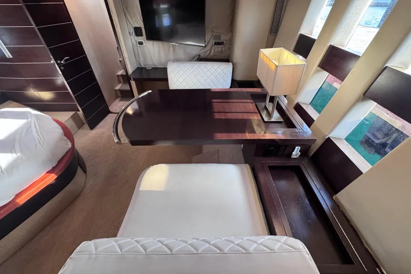 Slide: The Image of Luxurious interior of 2006 Azimut 68S yacht with elegant furnishings and natural light. - 76