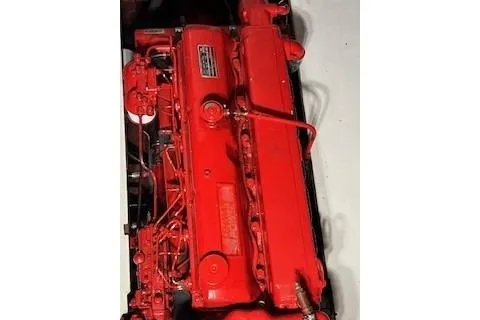 Slide: The Image of 1963 Wiley Trawler interior with visible red engine and seating area. - 10