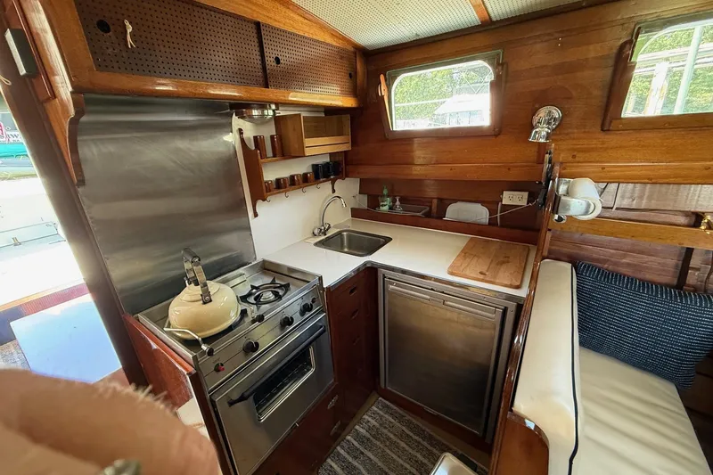 Slide: The Image of Red engine of a 1963 Wiley Trawler, showcasing intricate mechanical components. - 11