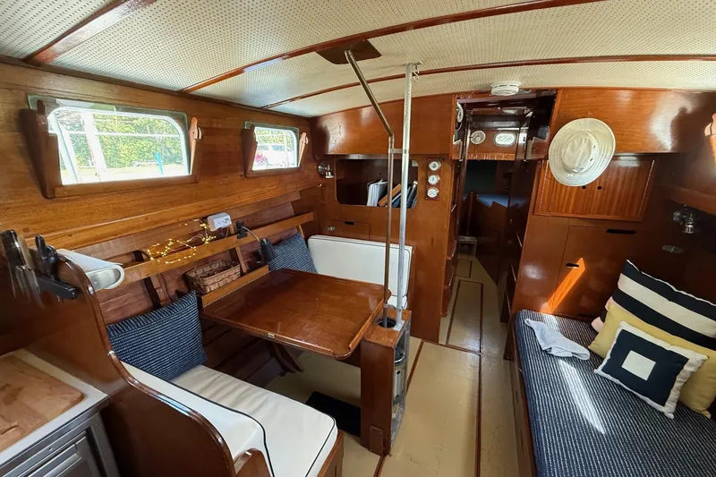 Slide: The Image of Engine compartment of a 1963 Wiley Trawler with visible hoses and fittings. - 12