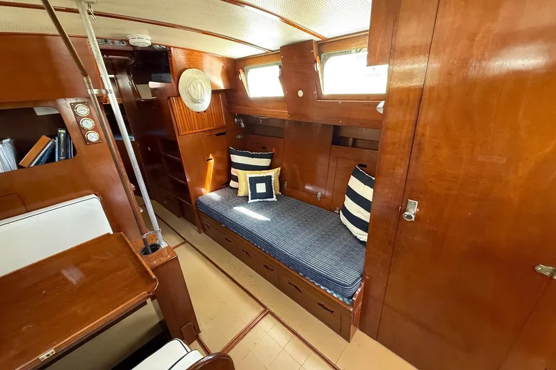 Slide: The Image of 1963 Wiley Trawler kitchen with stove, sink, and wooden cabinetry. - 13