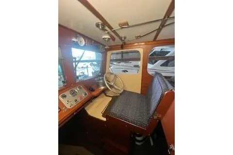 Slide: The Image of 1963 Wiley Trawler interior with wooden furnishings and cozy seating area. - 20