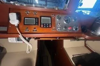 Slide: The Image of 1963 Wiley Trawler interior with wooden furnishings and cozy seating area. - 21