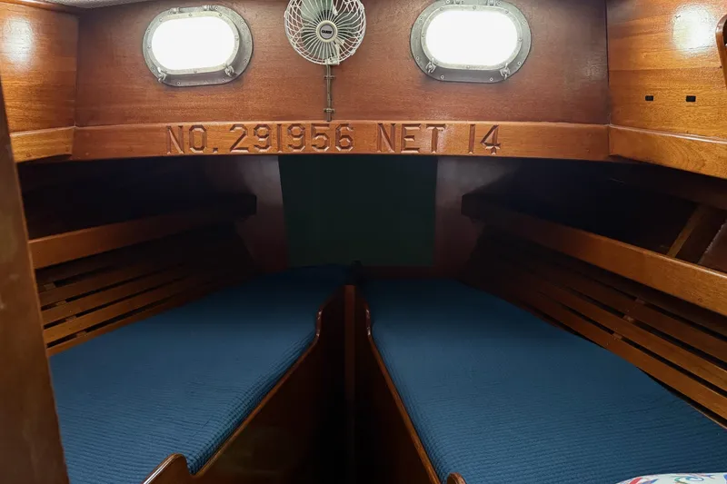 Slide: The Image of 1963 Wiley Trawler interior with vintage steering wheel and control panel. - 24