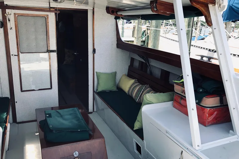 Slide: The Image of 1963 Wiley Trawler docked at marina, featuring green accents and classic design. - 5