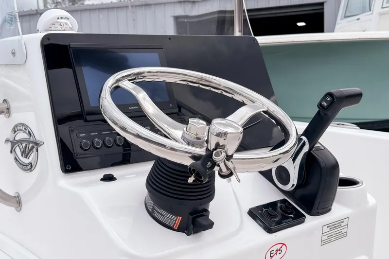 Slide: The Image of Steering console of 2026 Tidewater 180 CC Adventure boat with modern controls. - 11