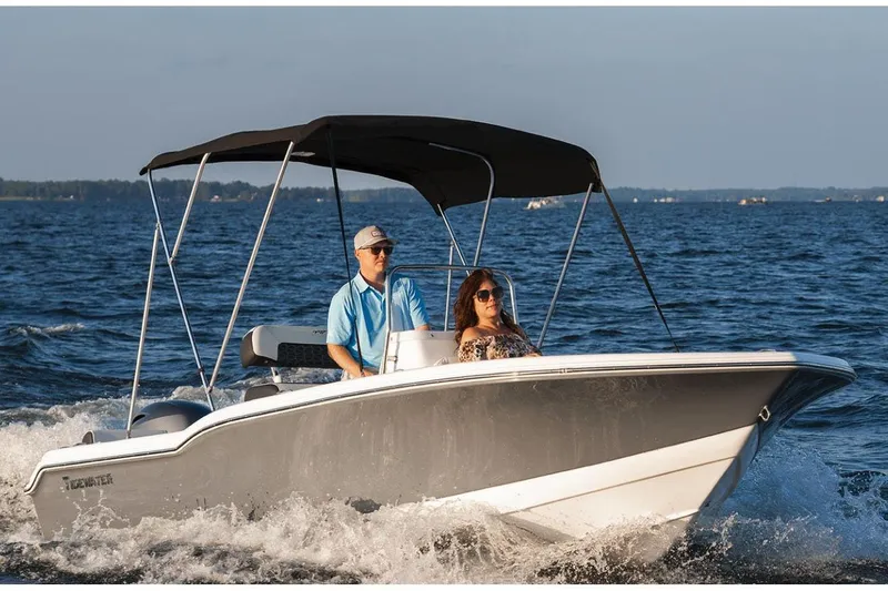 Slide: The Image of Manufacturer Provided Image: 2026 Tidewater 180 CC Adventure boat cruising on open water with two passengers. - 15