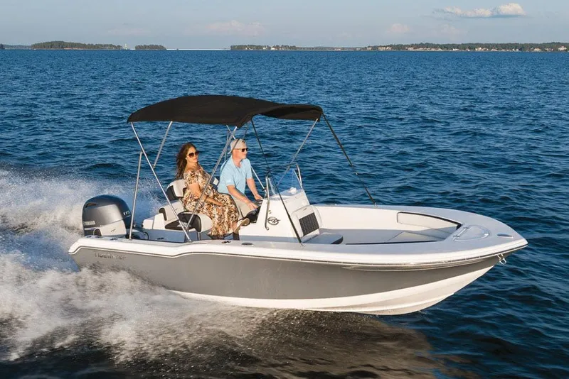 Slide: The Image of Manufacturer Provided Image: 2026 Tidewater 180 CC Adventure boat cruising on open water with two passengers. - 16