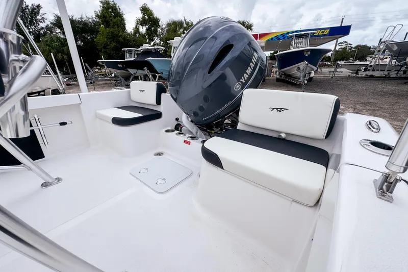Slide: The Image of 2026 Tidewater 180 CC Adventure boat interior with Yamaha engine, featuring sleek seating and storage. - 8