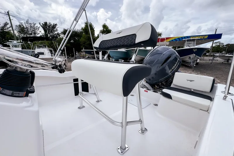 Slide: The Image of 2026 Tidewater 180 CC Adventure boat interior with Yamaha engine, featuring sleek seating and controls. - 9