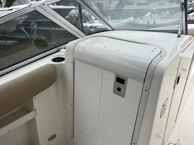 Slide: The Image of 2020 Key West 239 DFS boat interior with seating and storage compartment. - 11