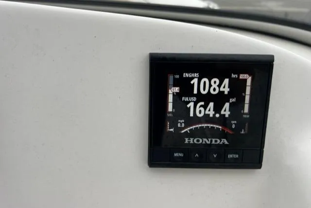 Slide: The Image of Honda engine hour meter on a 2020 Key West 239 DFS boat. - 13