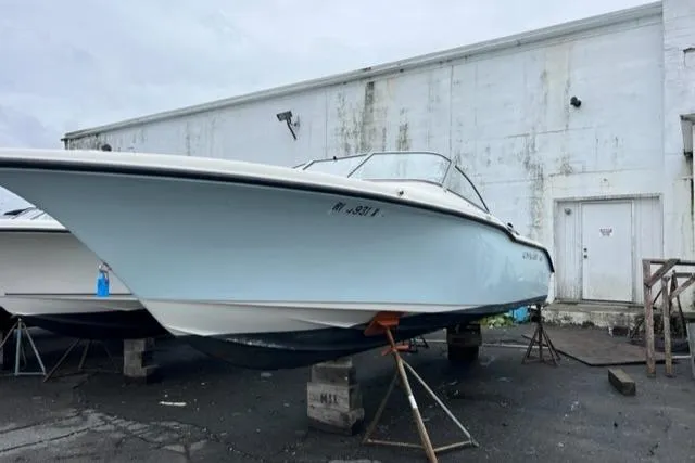 Slide: The Image of 2020 Key West 239 DFS boat on stands outside a warehouse. - 2