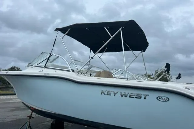 Slide: The Image of 2020 Key West 239 DFS boat with black canopy on trailer. - 3