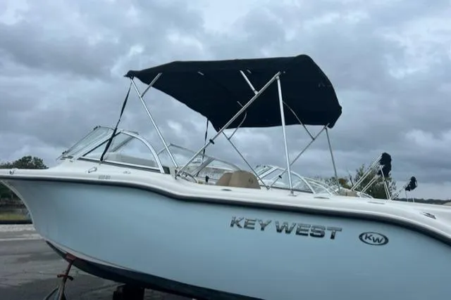 Slide: The Image of 2020 Key West 239 DFS boat with black canopy on a cloudy day. - 4