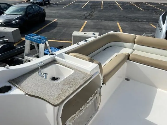 Slide: The Image of 2020 Key West 239 DFS boat interior with seating and sink. - 8