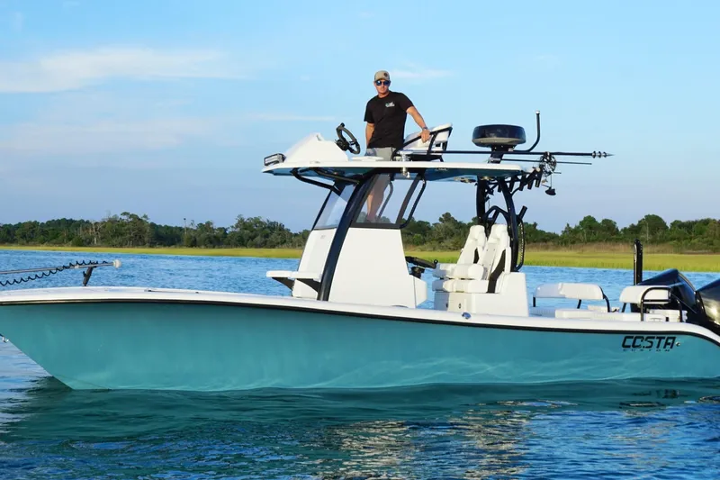 Slide: The Image of 2025 Costa Custom Boats 264 HC on water, featuring sleek design and modern amenities. - 11