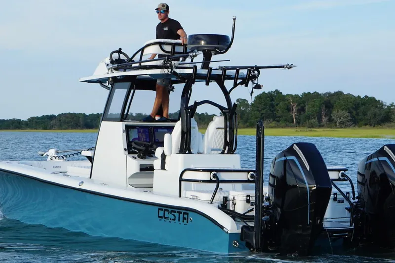 Slide: The Image of 2025 Costa Custom Boats 264 HC on water, featuring sleek design and modern amenities. - 8