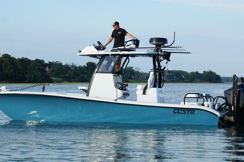 Slide: The Image of 2025 Costa Custom Boats 264 HC on water, featuring sleek design and modern amenities. - 9