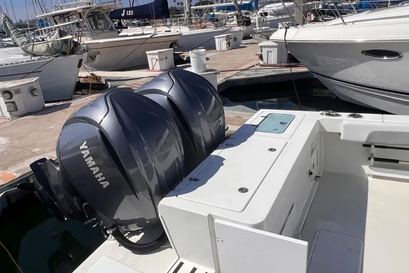 Slide: The Image of 2023 Parker 2820 XLD Sport Cabin with Yamaha outboard engines at marina dock. - 11