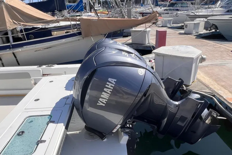 Slide: The Image of 2023 Parker 2820 XLD Sport Cabin with Yamaha outboard engine at marina. - 12