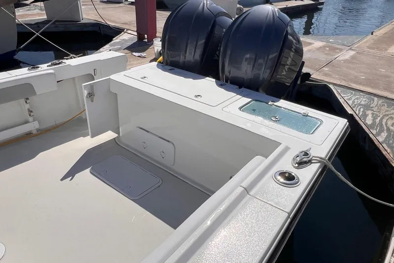 Slide: The Image of 2023 Parker 2820 XLD Sport Cabin boat with dual outboard motors at dock. - 20
